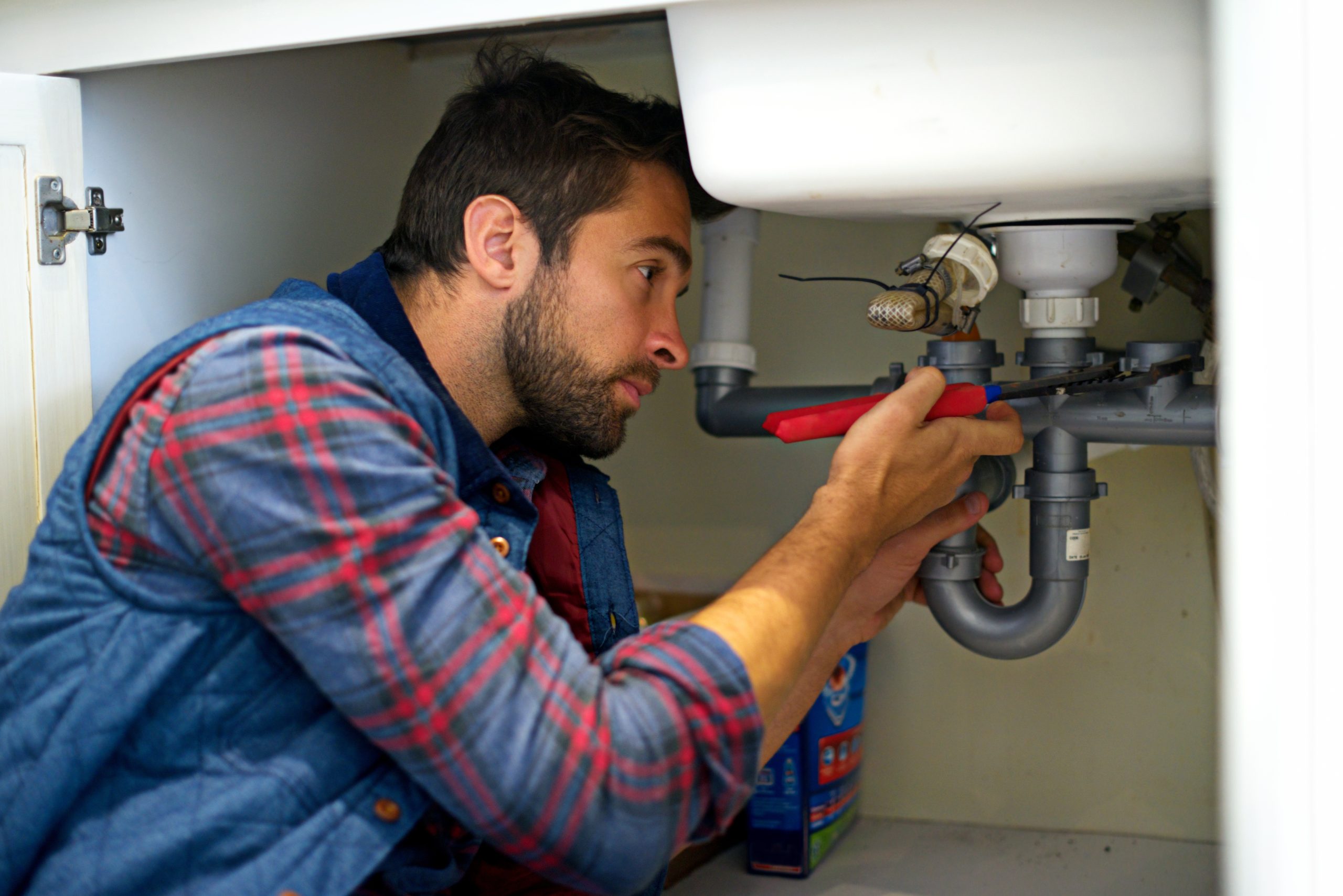 I think I see your problem. Shot of a plumber fixing a pipe